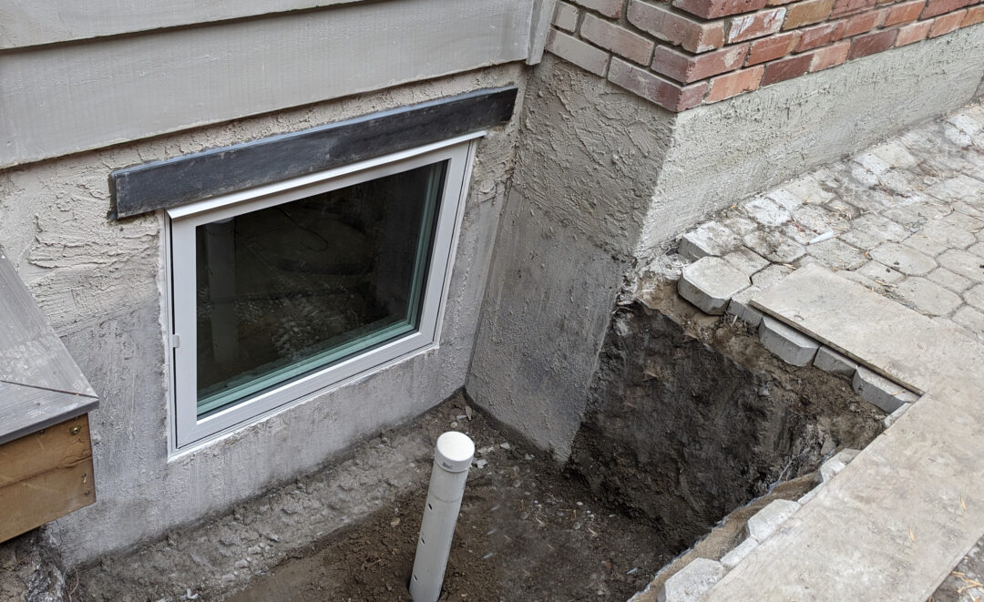 Basement window install with drain capp